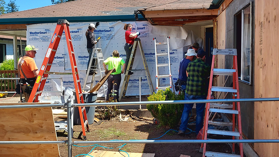 A group of Pre-Apprenticeship students working on home construction